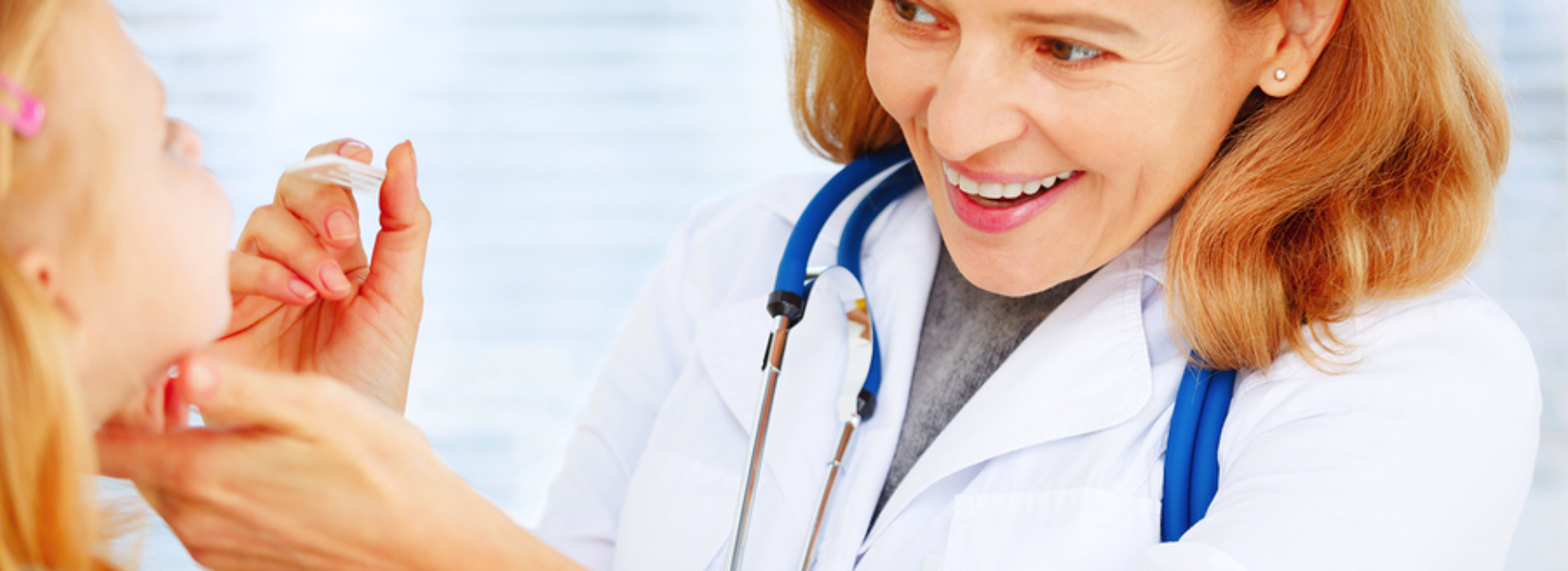 3 2 Woman Provider Checking Childs Mouth 1 1920x700 c