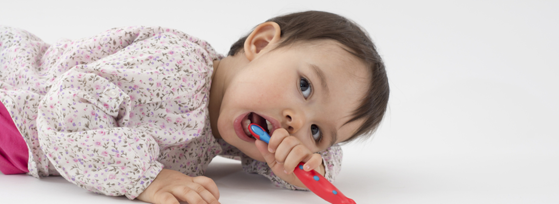 Little Girl With Toothbrush on Floor 1920x700 c